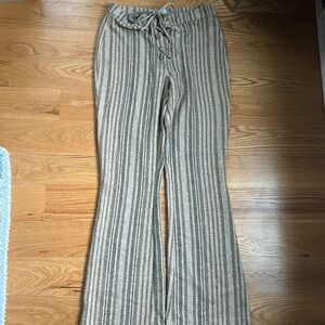 Indie Urban Outfits brown and tan stripped flared pants.